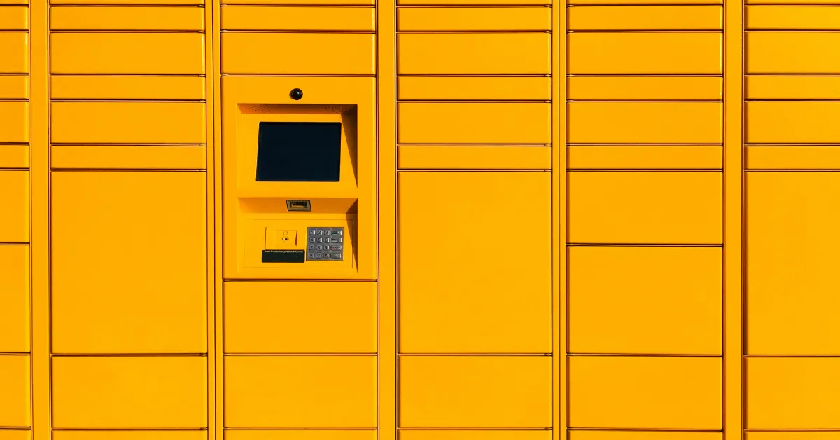 A wall of bold yellow lockers with a single digital keypad. This is what it looks like when you're locked in by bad habits, needing a code on how to break bad habits and find simplified living.